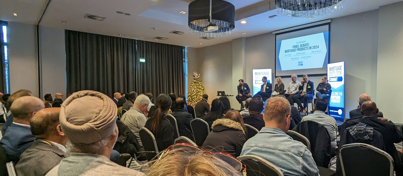 Audience watching an industry panel debate at a mortgage summit