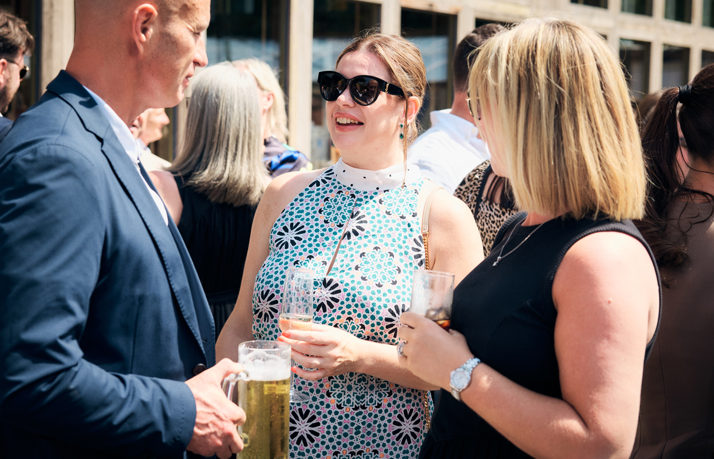 Industry professionals talking together at a summer networking event
